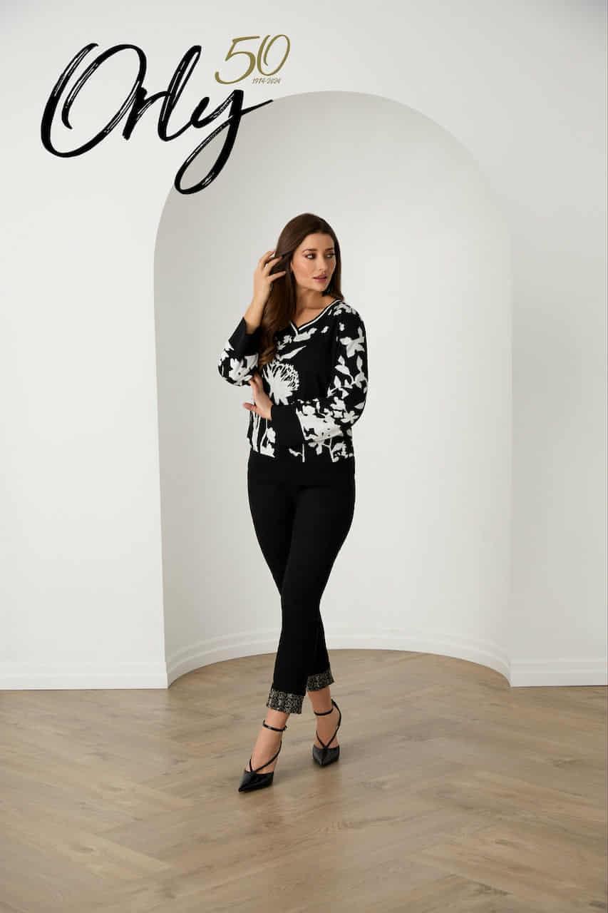 Black slim jeans with sparkling embellished ankle cuff, styled with heels