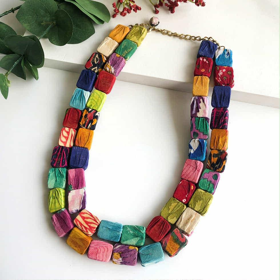 Colorful handmade WorldFinds Kantha Square Necklace made from repurposed sari fabric
