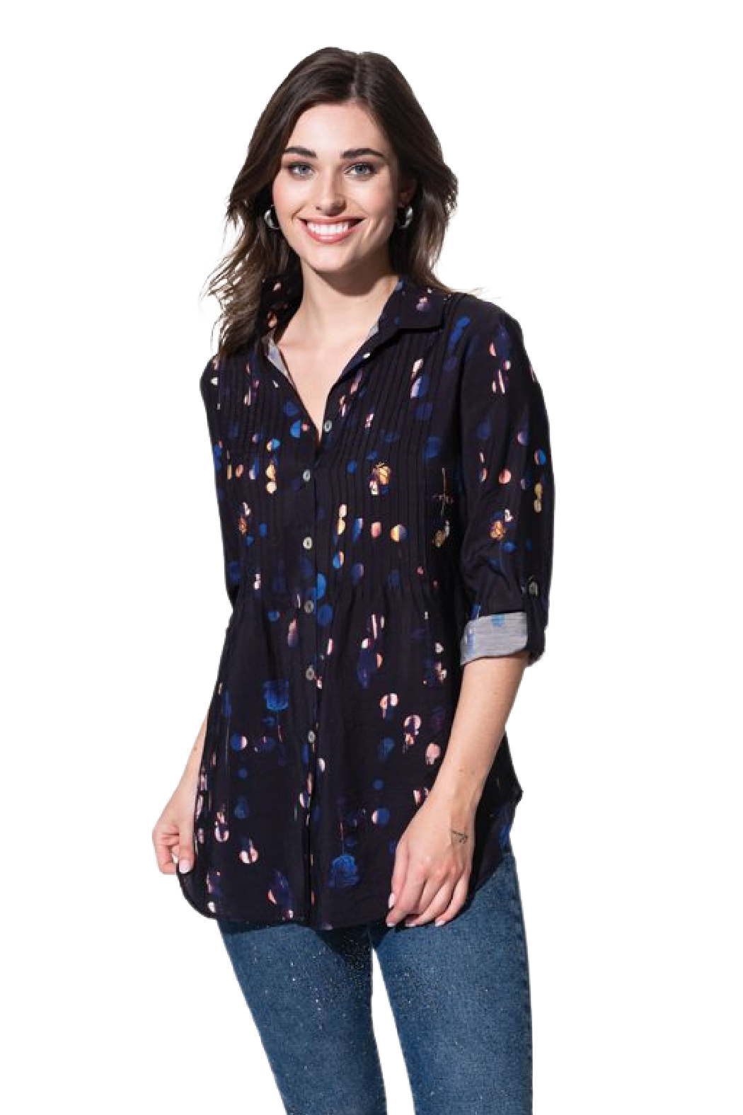 A woman wearing a black blouse with a pleated bust and tabbed sleeves, featuring a button front. She is also wearing blue jeans.