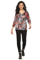 woman wearing abstract print V-neck top with leggings