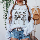 . Gray Feelin’ Witchy sweatshirt with vintage witch trio graphic