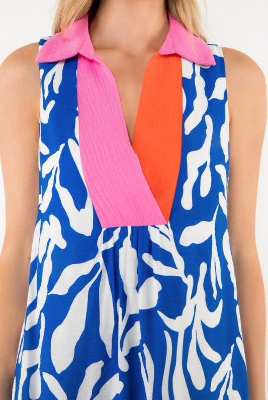 Close-up of pink collar and orange inset on printed sleeveless dress
