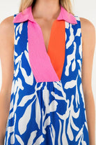 Close-up of pink collar and orange inset on printed sleeveless dress