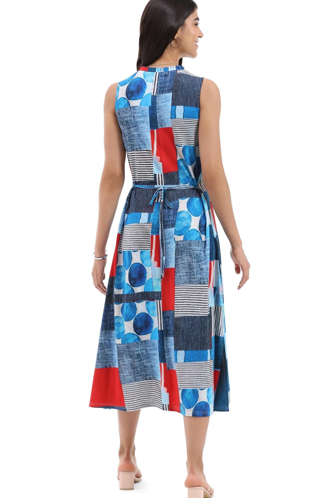 Woman wearing a colorful geometric patterned dress on a white background, Pa, back viewrsley & Sage sleeveless abstract knit dress with pockets for women