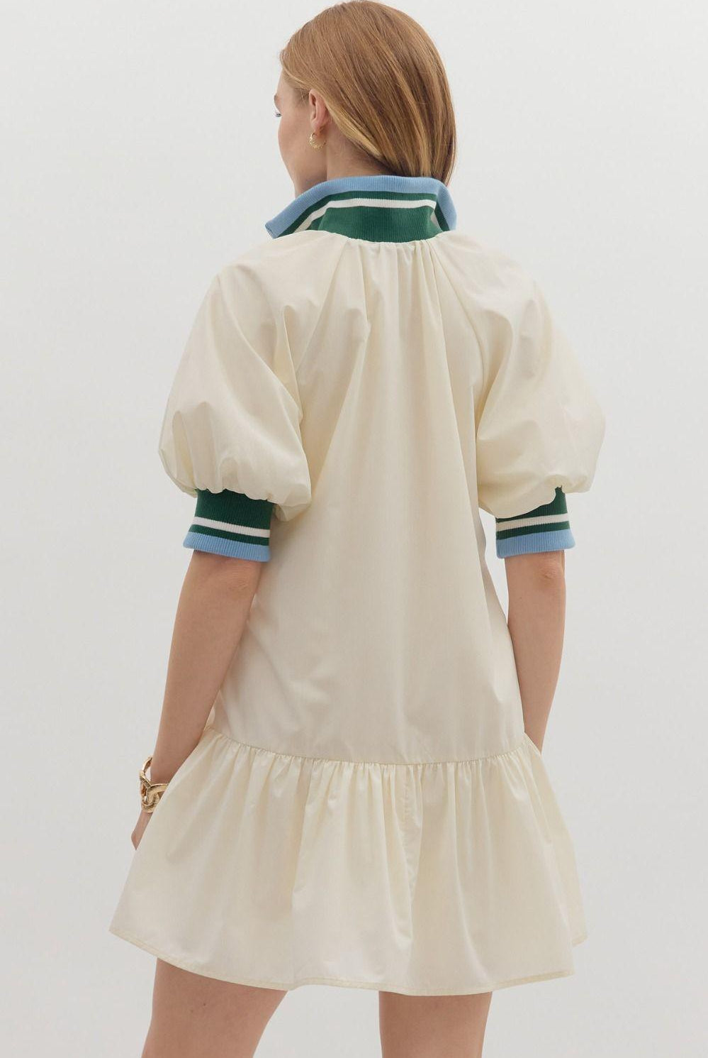Sporty chic cream half-zip dress with puff sleeves and contrast striped collar, back view
