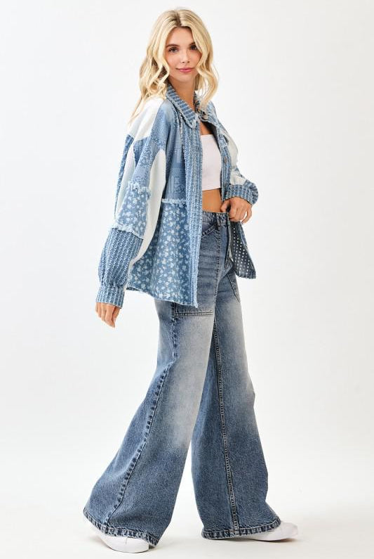 Woman wearing a denim outfit with a white background, side view