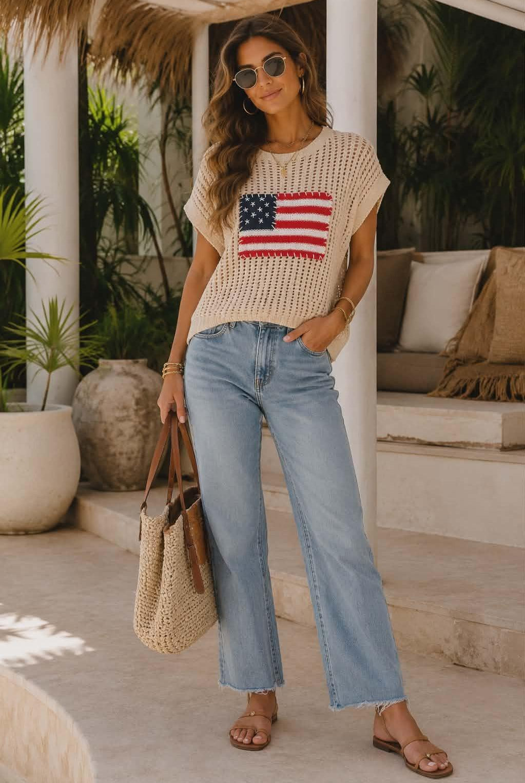 Women's oatmeal open-knit sweater featuring an American flag appliqué patch and relaxed resort-inspired silhouette.