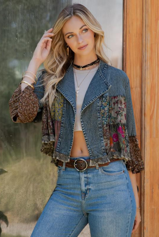 Woman wearing boho patchwork denim jacket with floral sleeves and ruffle cuffs from Petunias of Naples