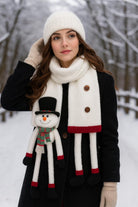 White whimsical snowman scarf with top hat, carrot nose, festive details, and plush fabric – cozy winter accessory and holiday gift