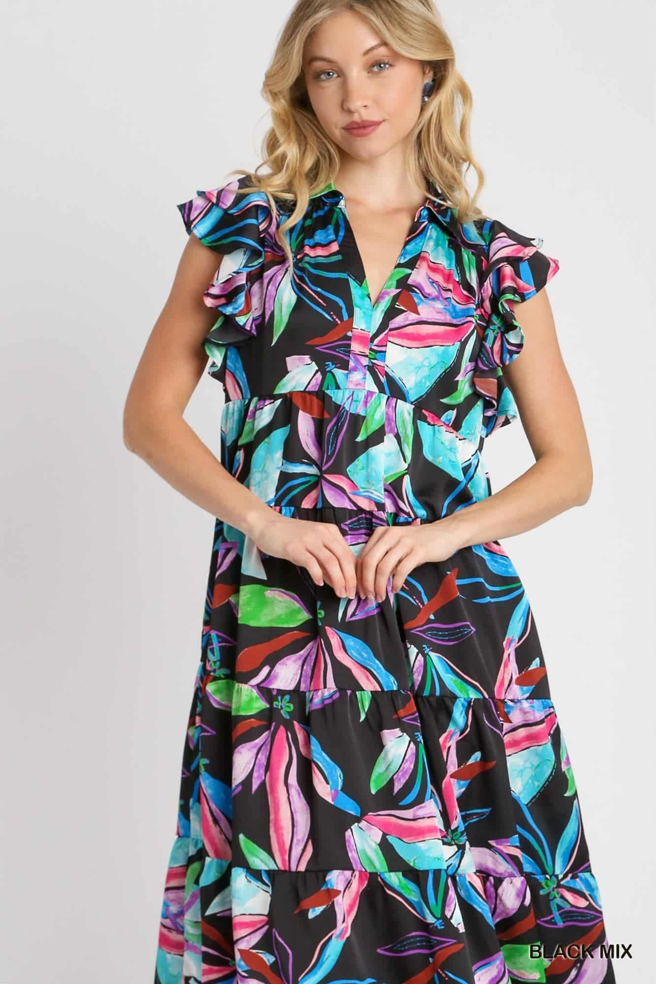 Woman wearing a colorful dress with a black background