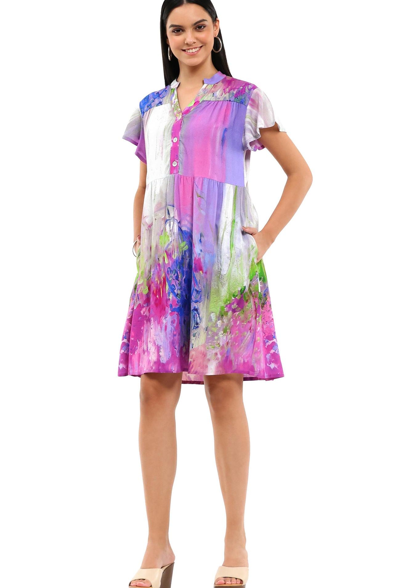 Woman wearing a colorful dress on a white background