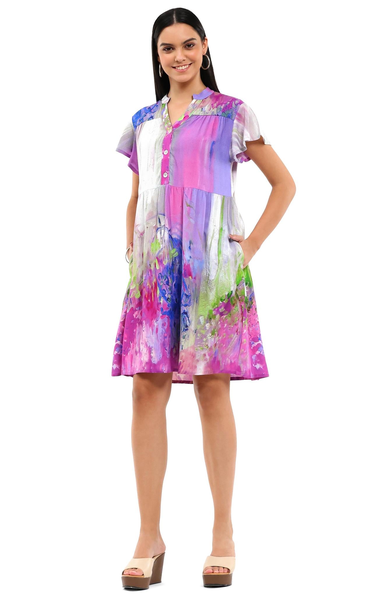 Woman wearing a colorful dress on a white background