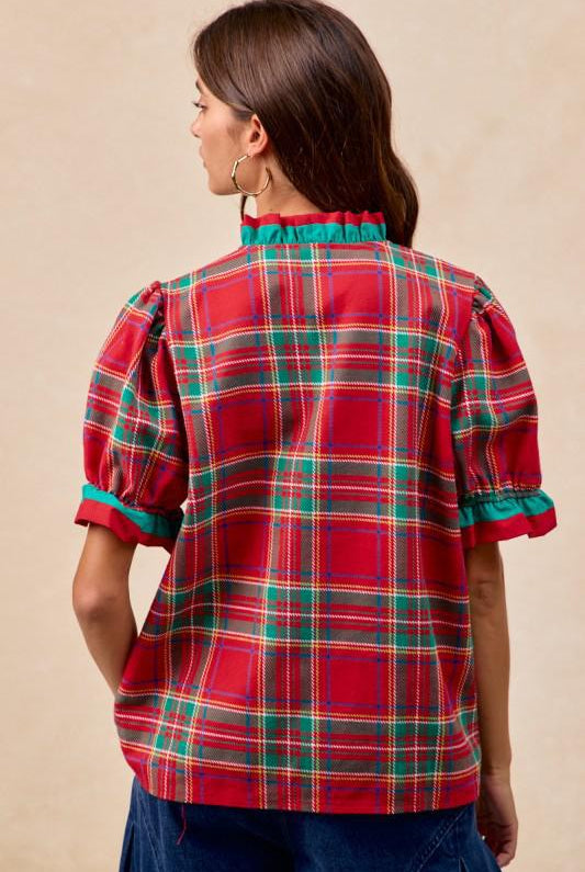 Back View Woman wearing red plaid blouse with green trim and ruffled puff sleeves – festive holiday top by Petunias of Naples