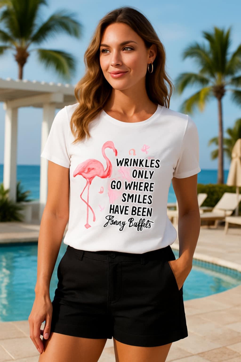 Woman styled in Jimmy Buffett flamingo t-shirt with black tailored shorts in tropical resort setting