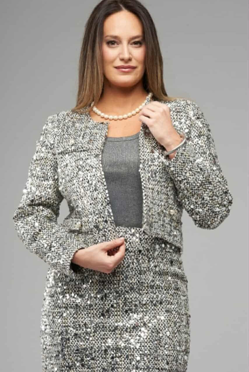 Woman wearing silver sequin tweed cropped jacket by Insight NY in studio lighting