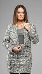 Woman wearing silver sequin tweed cropped jacket by Insight NY in studio lighting