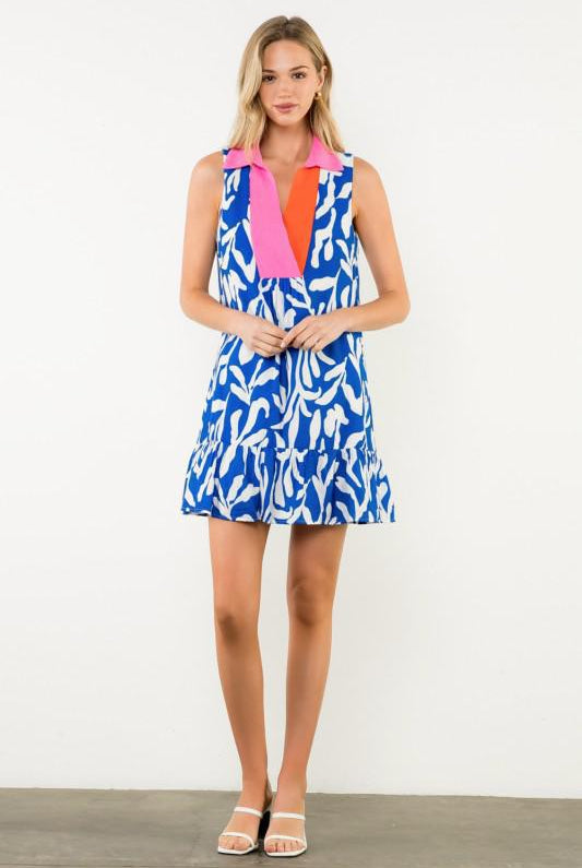 Woman wearing a colorful dress with a white background