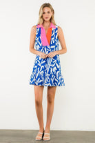 Woman wearing a colorful dress with a white background