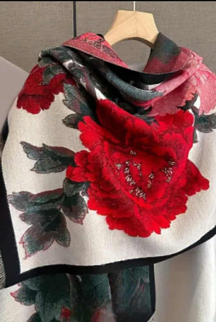 “Red floral jacquard wrap displayed on hanger with peony print”