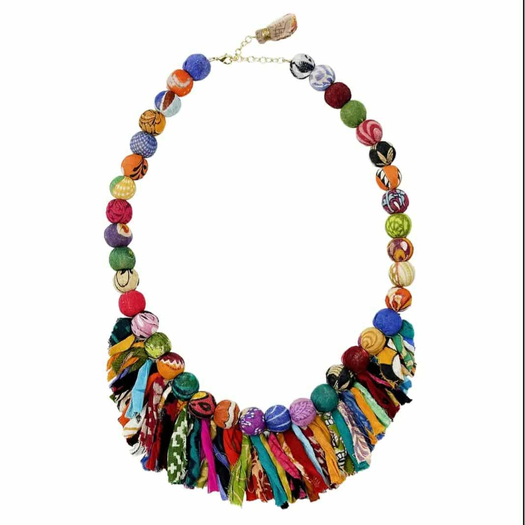 World Finds fair trade necklace with colorful fabric beads and tassel accents, handcrafted from repurposed textiles