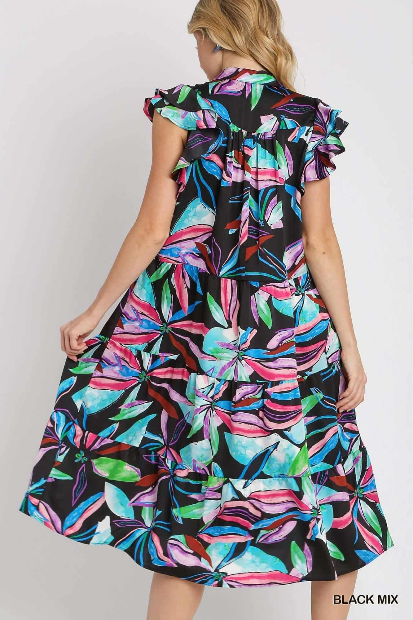 Back view of ruffled tiered tropical dress