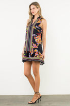 Woman wearing a floral dress with a white background