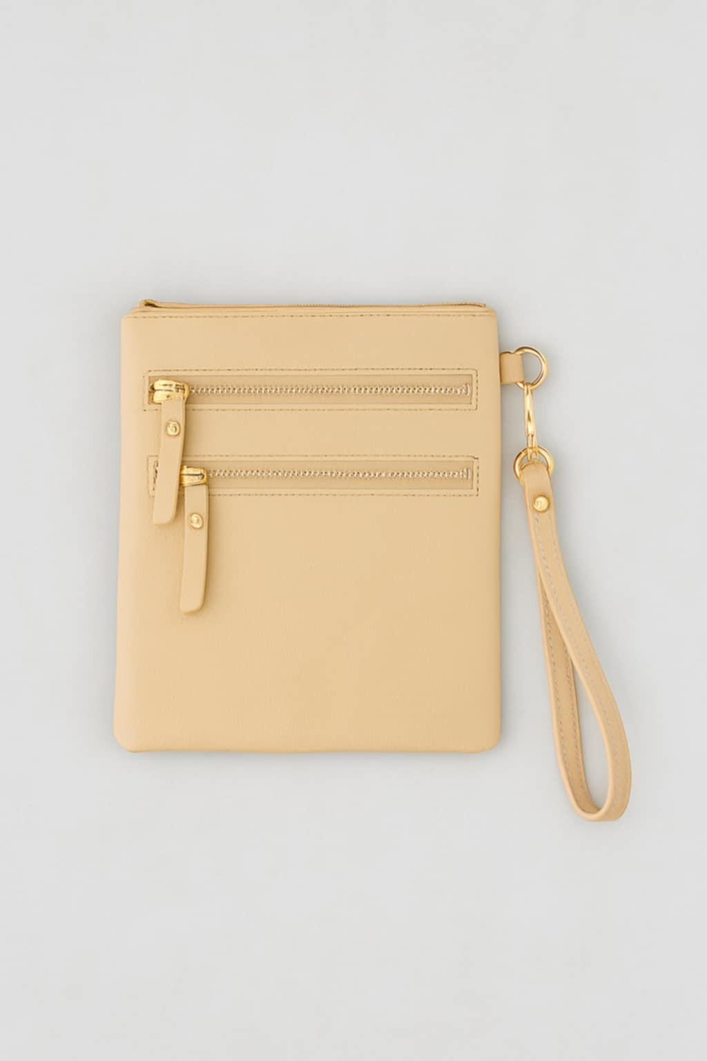 “Convertible nude wristlet and crossbody bag with gold hardware”