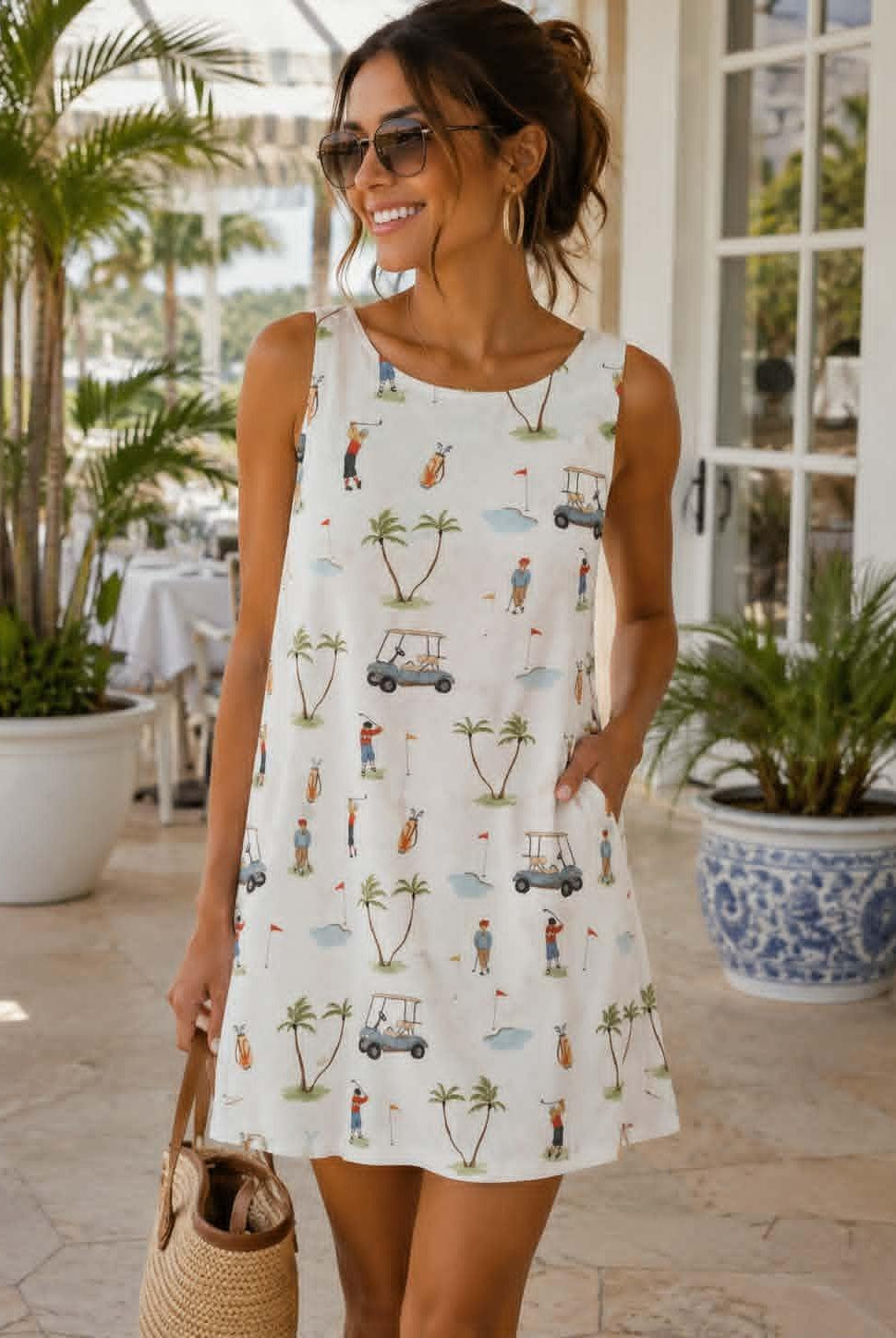 Bailey Rose white sleeveless golf print A-line dress with golfers, golf carts, palm trees, V-back neckline and exposed back zipper.