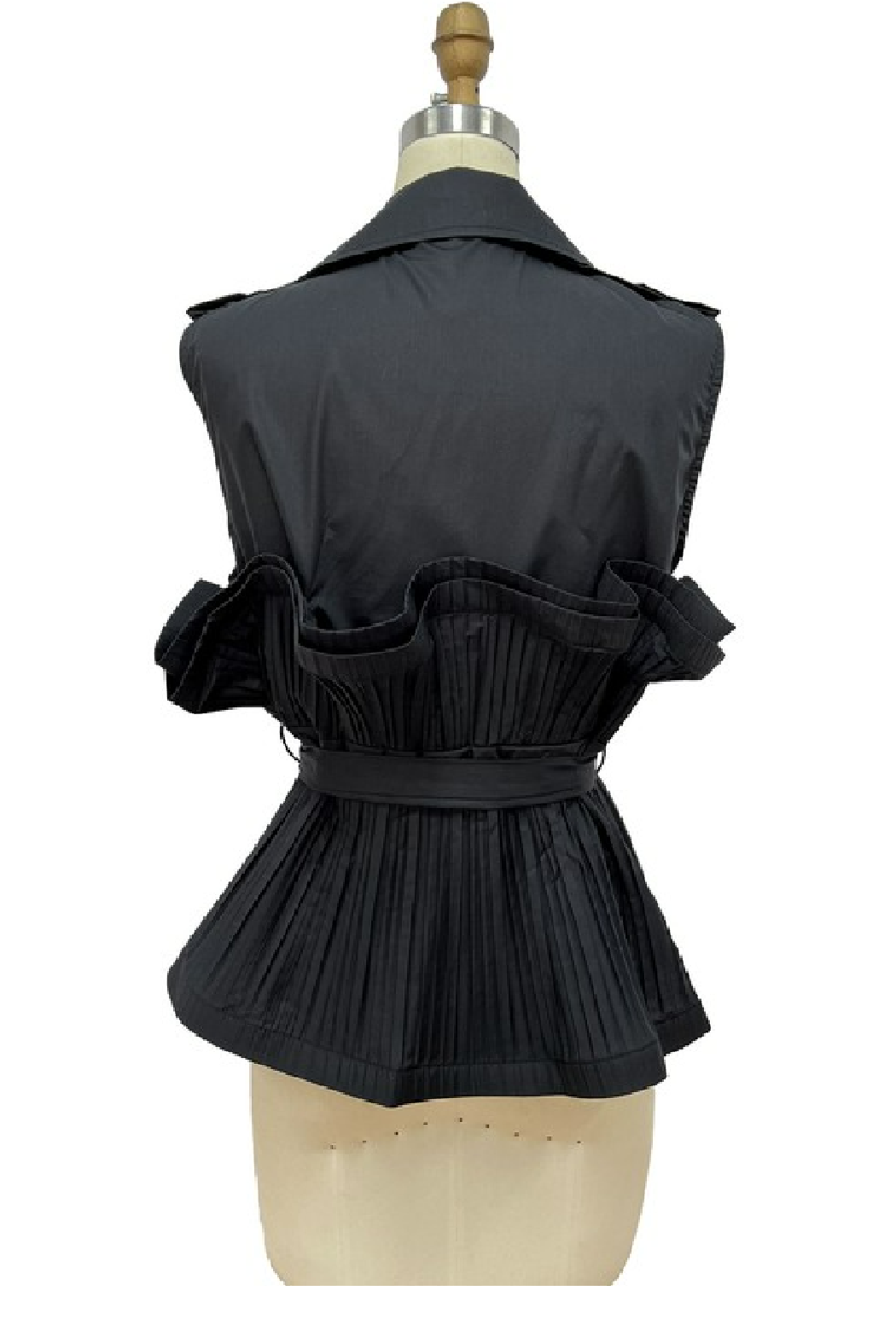 A black sleeveless vest with a wide collar, ruffled shoulders, and a pleated peplum waist, displayed on a beige dress form against a white background.