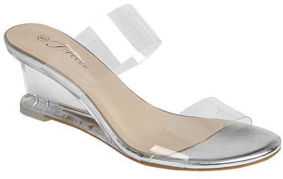 Clear wedge slide sandal with silver footbed and transparent double straps.