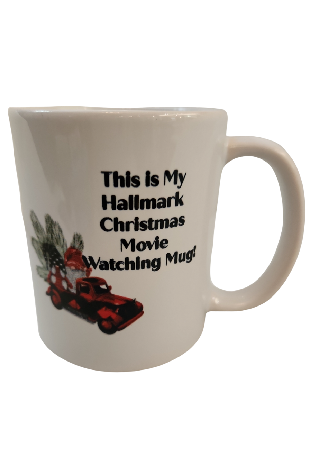 A white ceramic mug with red and green Christmas-themed decoration, including a vintage red truck, a Christmas tree, and text that reads 'This is My Hallmark Christmas Movie Watching Mug'.