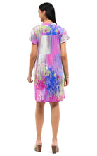 Parsley & Sage watercolor rayon dress with flutter sleeves worn by resort chic model, back view