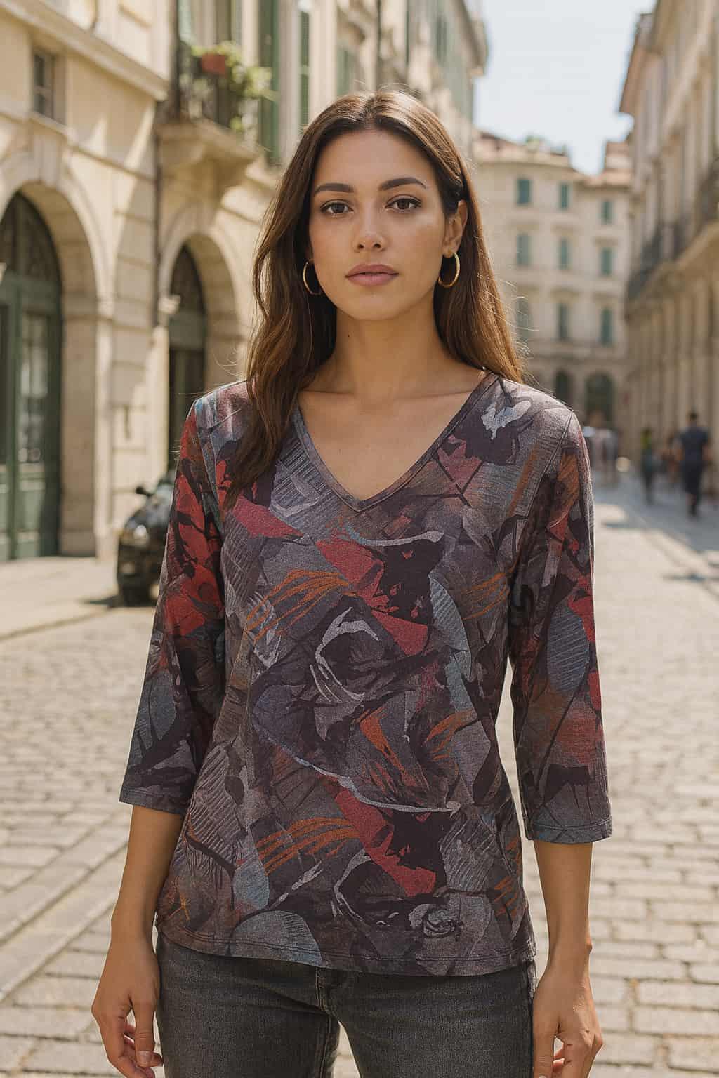 Beautiful urban chic woman wearing abstract print V-neck top