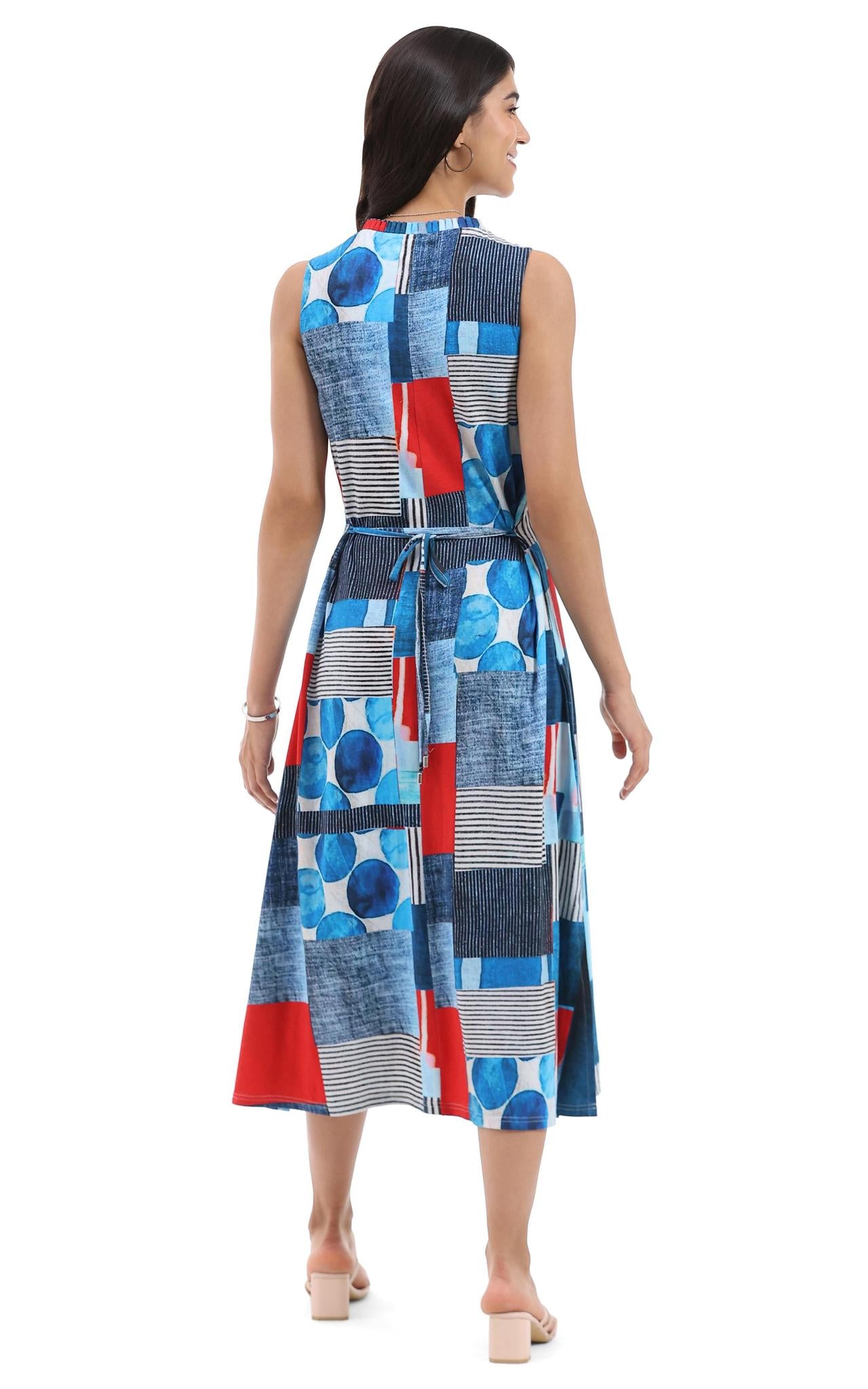 Woman wearing a colorful geometric patterned dress on a white background, Pa, back viewrsley & Sage sleeveless abstract knit dress with pockets for women