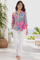 Parsley & Sage floral stripe 100 percent cotton blouse with botanical print and button front shown on resort style model
