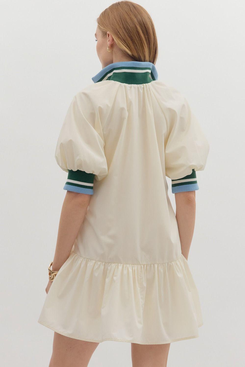 Sporty chic cream half-zip dress with puff sleeves and contrast striped collar, back view