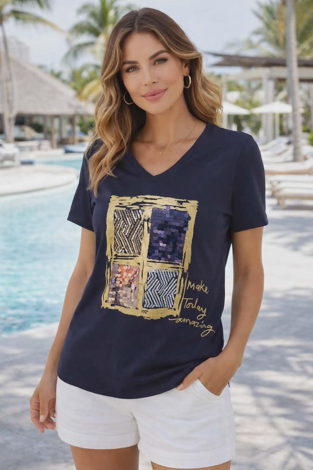 Michael Tyler navy V-neck tee with sequin square graphic and “Make Today Amazing” gold script on a resort-chic model