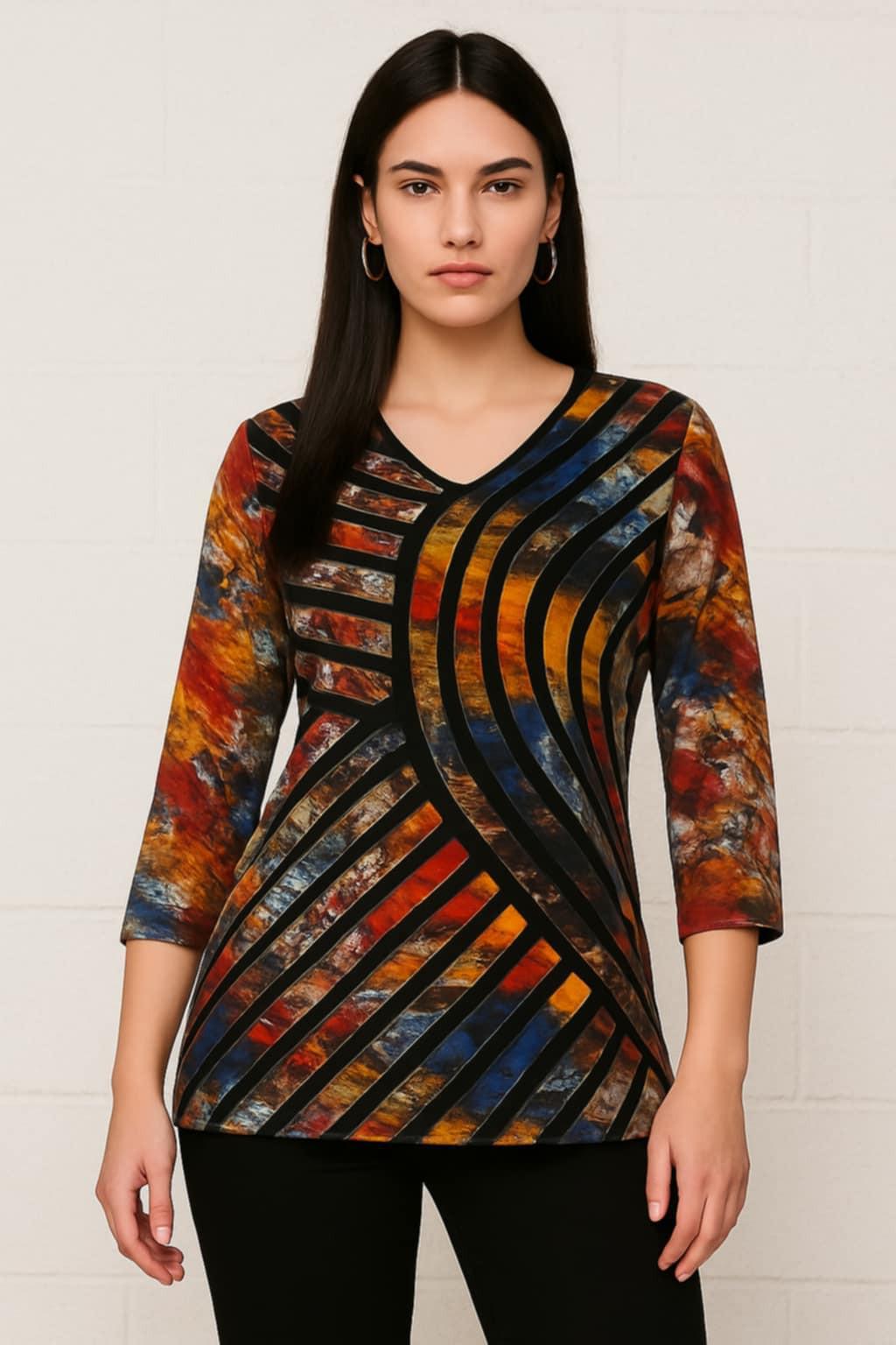 Woman wearing a Parsley & Sage multi-color abstract print V-neck tunic with black geometric stripe design and 3/4 sleeves, paired with black pants.