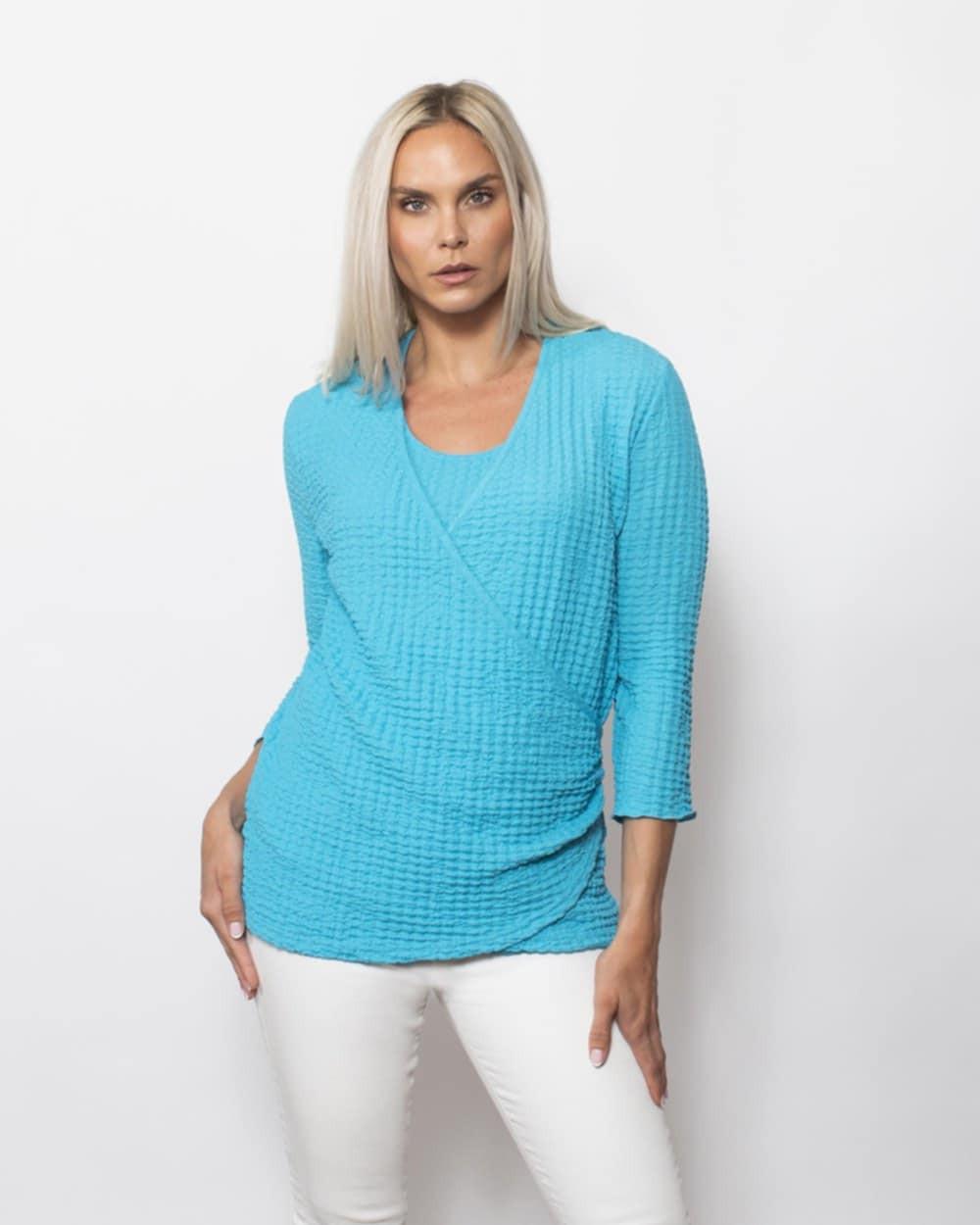 "Blue textured wrap blouse by Sno Skins made in the USA with 3/4 sleeves – chic resort wear top"
