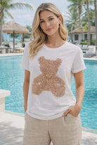 Michael Tyler ruffle teddy bear tee with crystal accents worn by resort chic model