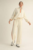 Women’s contrast stripe knit lounge set with half-zip top and wide-leg pants