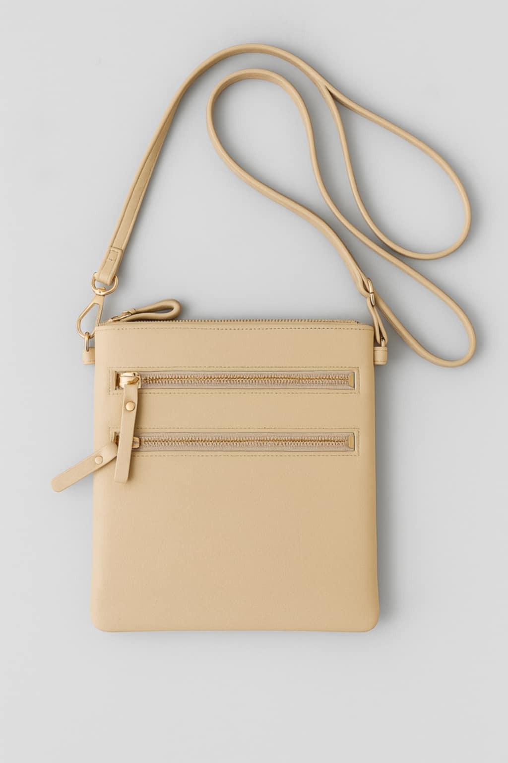  “Nude vegan leather purse with gold zippers and convertible straps” “Nude vegan leather purse with gold zippers and convertible straps”