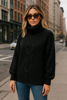  Woman wearing black chunky knit sweater with jeans – urban chic look