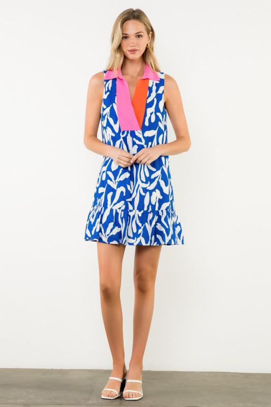 Woman wearing a colorful dress with a white background