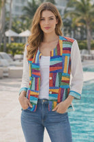 Parsley & Sage colorful knit jacket with button-front design, styled with jeans in a resort chic setting