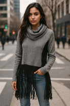 Front view of grey cowl neck sweater with black faux suede panels and 