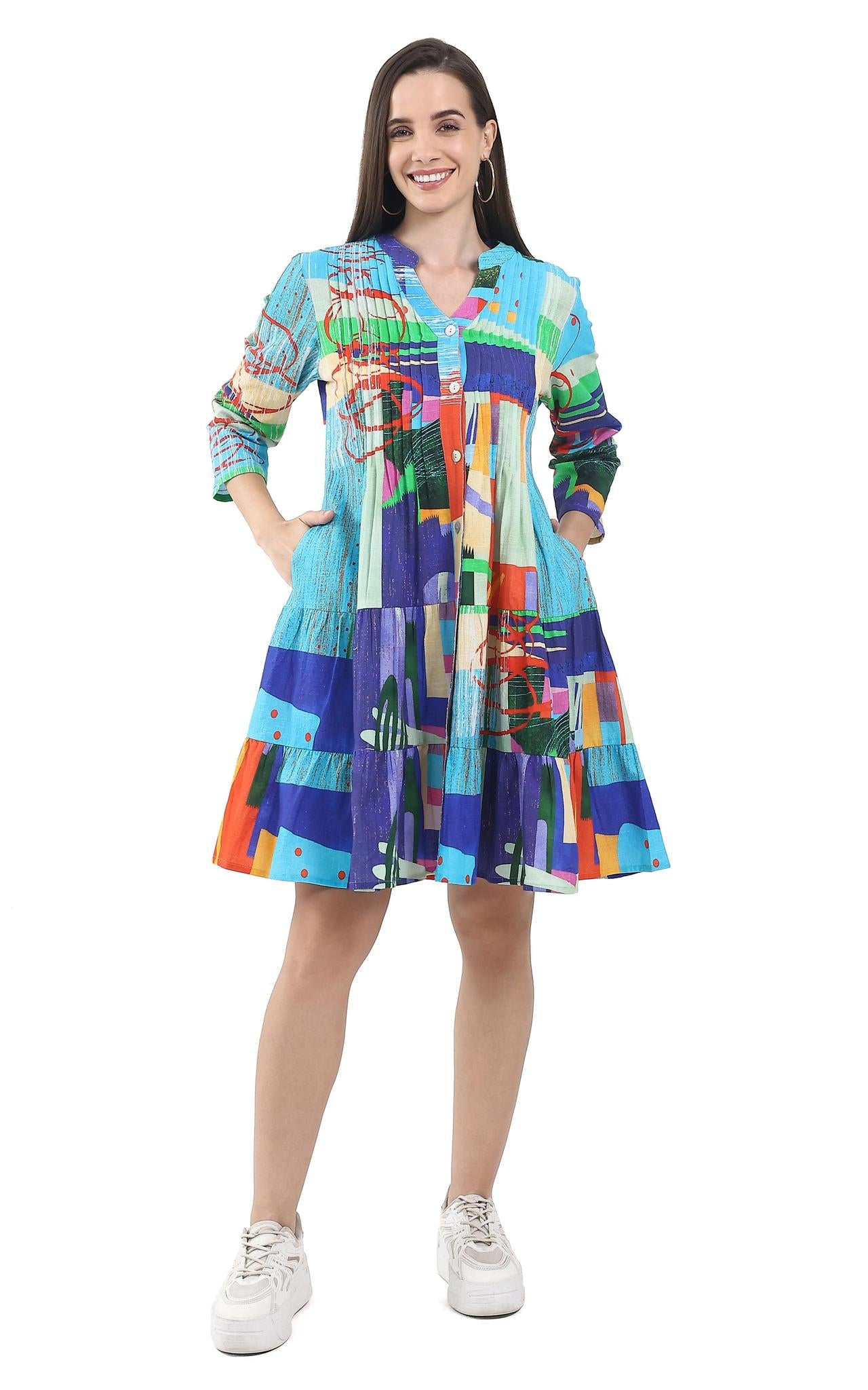 Woman wearing a colorful patterned dress on a white background