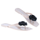 Ivory jelly slide sandal with black flower detail, flat sole, chic summer resort footwear