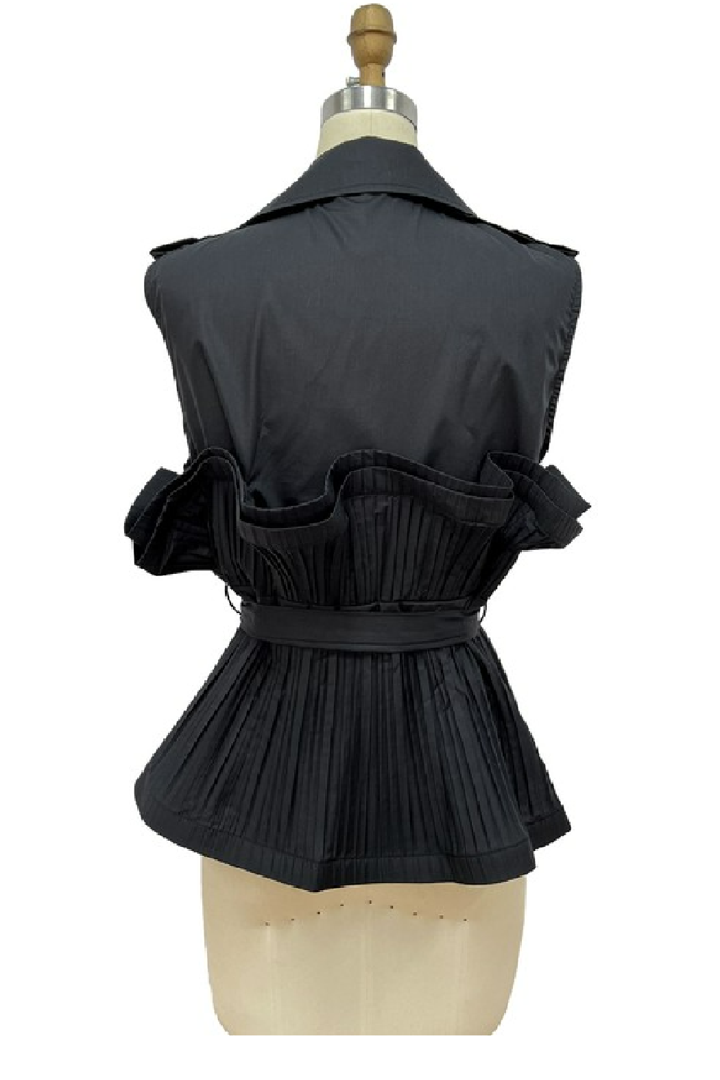 A black sleeveless vest with a wide collar, ruffled shoulders, and a pleated peplum waist, displayed on a beige dress form against a white background.